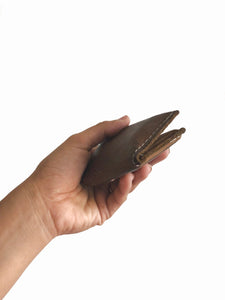Brown small bifold handcrafted wallet. Each side holds 10 cards. We love putting folded bills on one side and cards on the other.