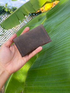 Brown small bifold handcrafted wallet. Each side holds 10 cards. We love putting folded bills on one side and cards on the other.