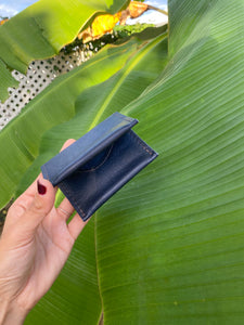 Blue small bifold handcrafted wallet. Each side holds 10 cards. We love putting folded bills on one side and cards on the other.