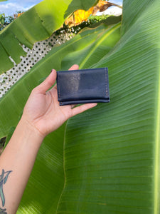 Blue small bifold handcrafted wallet. Each side holds 10 cards. We love putting folded bills on one side and cards on the other.
