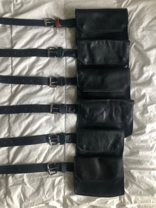 Multiple black handmade genuine leather fanny pack (hipsack), can be used as a cross-body bag. Hand-crafted in Puerto Rico. Oduardo is a husband and wife leather goods handmade small-batch fair trade shop. We make all our products by hand. In our shop you can find convertible messenger bags, leather backpacks, leather briefcases, leather cross-body bags, leather passport covers, leather wallets, leather bifold wallets, and more!