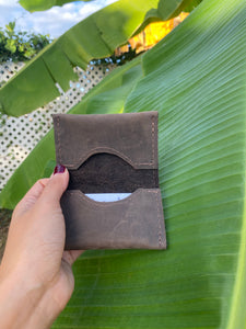 Brown small bifold handcrafted wallet. Each side holds 10 cards. We love putting folded bills on one side and cards on the other.